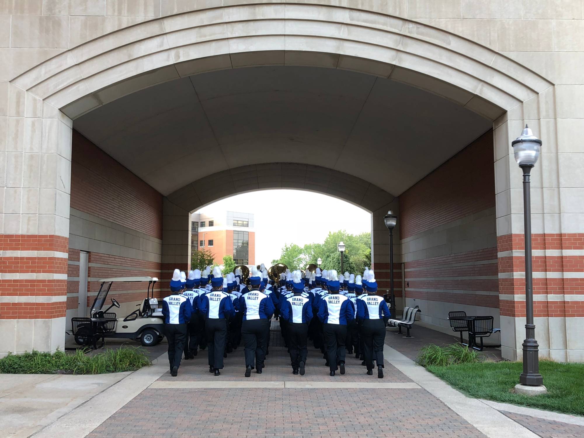 LMB marching under an archway